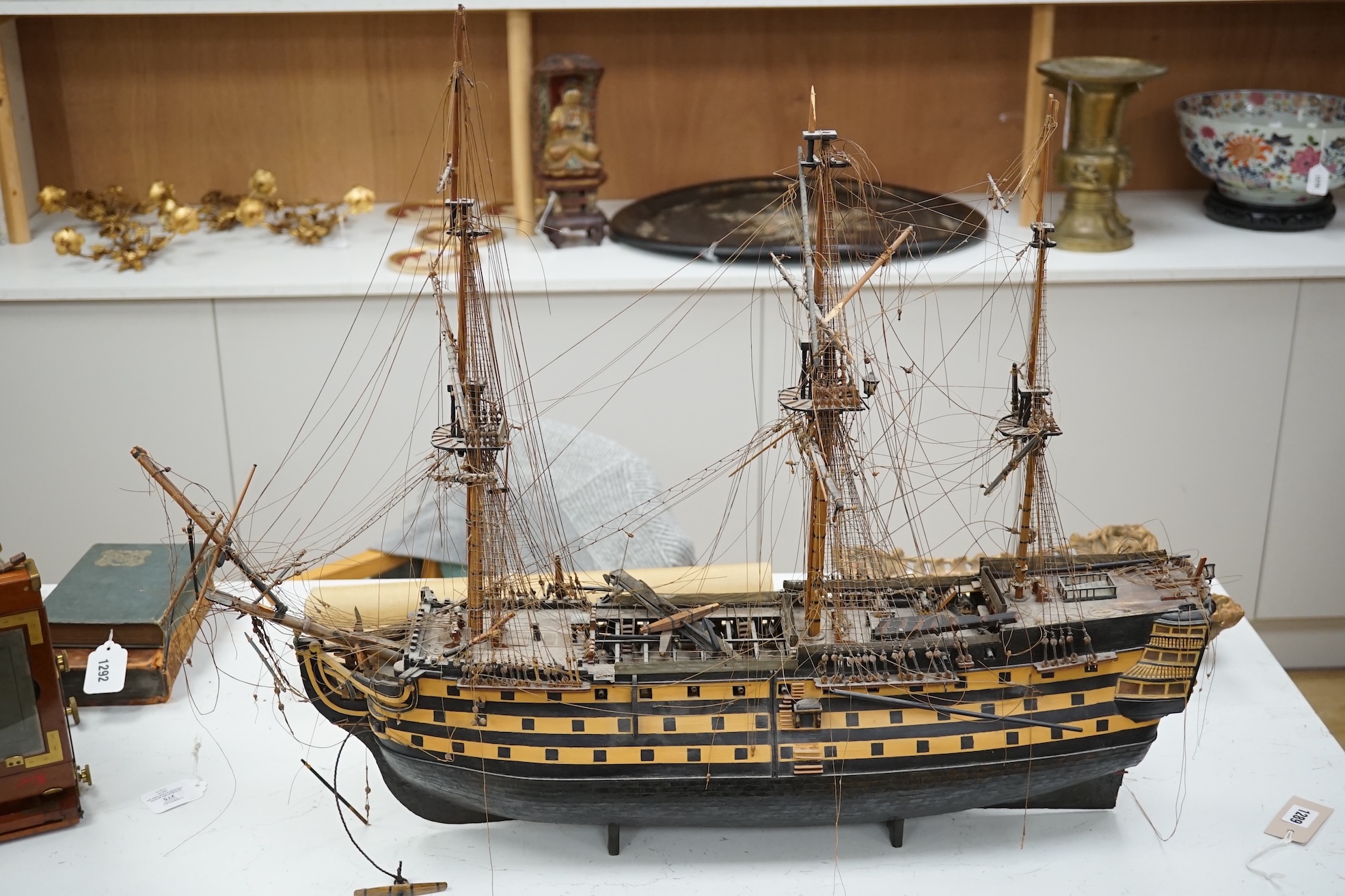 A large model of a rigged ship, 84cm long. Condition - fair